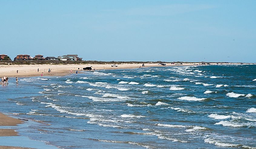 People enjoying the waves at Matagorda Beach, Texas
