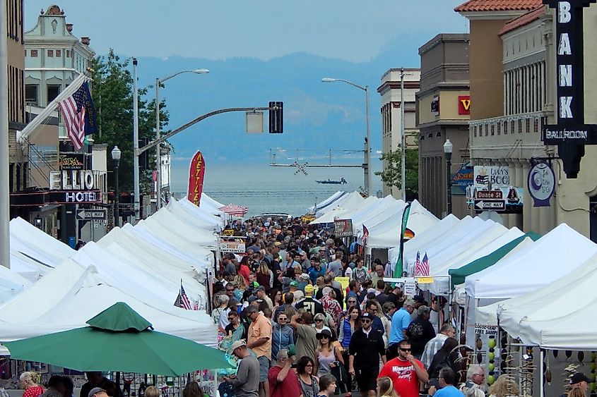 Shoppers enjoying Independent crafts and homemade goods at the Weekly Astoria Sunday Market and Craft Fair