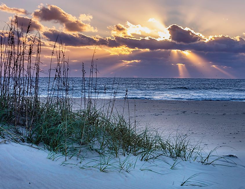 Frisco, North Carolina - 18 November 2020: Rays filter through the clouds as the sun begins to rise on the Outer Banks