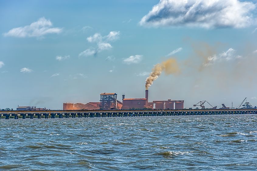 A bauxite industrial complex on the coast at Guinea, West Africa.Via Shutterstock / Igor Grochev.