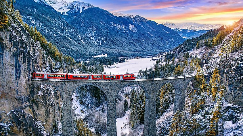 A train running along the Swiss Alps.