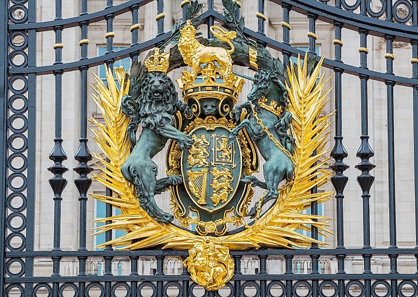 Royal Coat of Arms on the main gate of Buckingham Palace in London, UK.