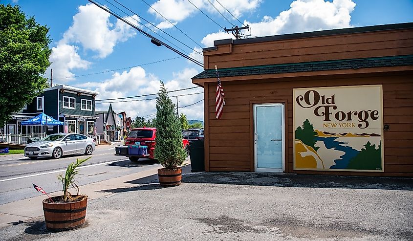 Cars drive down the road in Old Forge, New York.