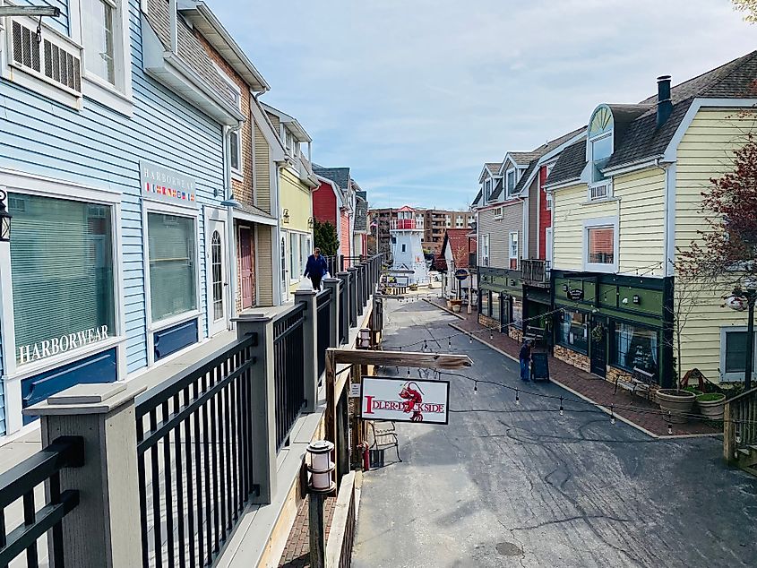 A replica maritime village with shops just opening up for the day.