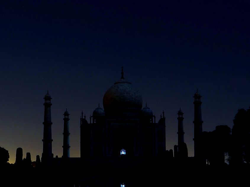 The silhouette of the Taj Mahal at night
