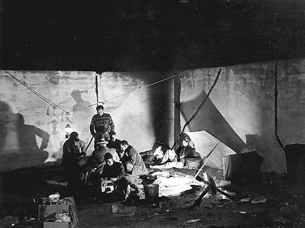 Men camping in a deserted pool in Ellaville in 1949.