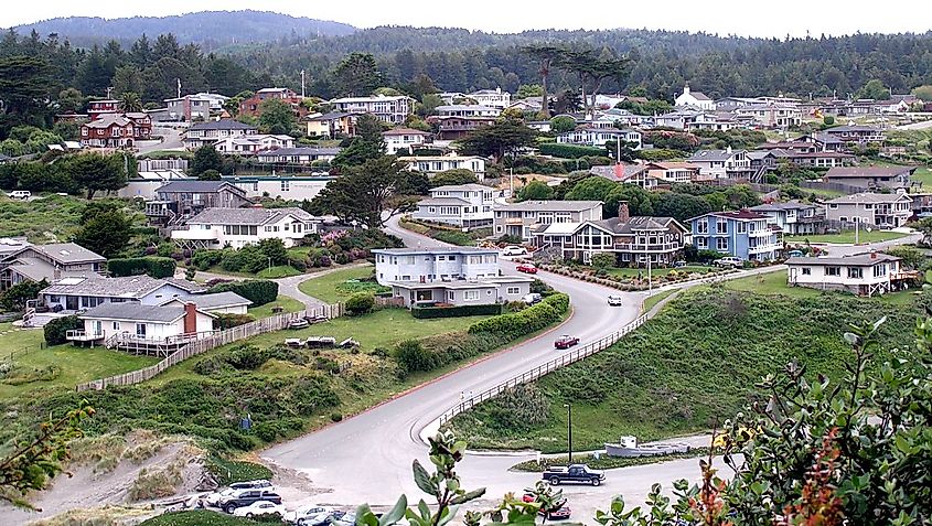 The coastal town of Trinidad, California, viewed from a trail on nearby Trinidad Head, offering a scenic overlook of the town, coastline, and the Pacific Ocean.