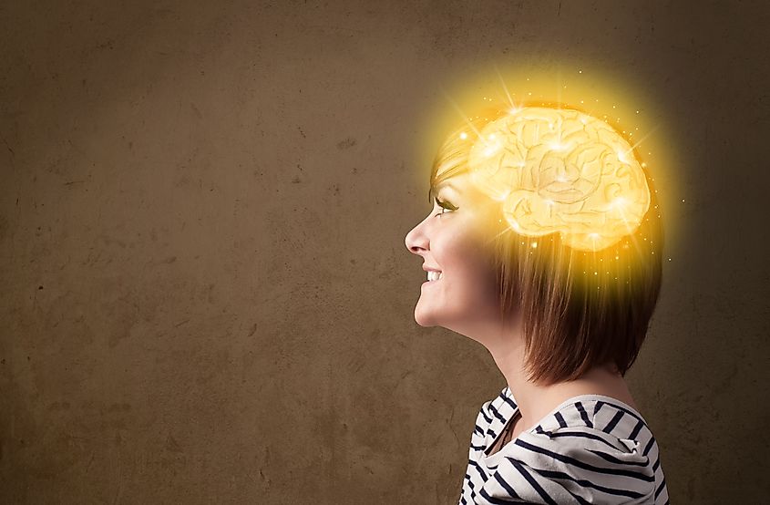 Girl with brain glowing from thinking