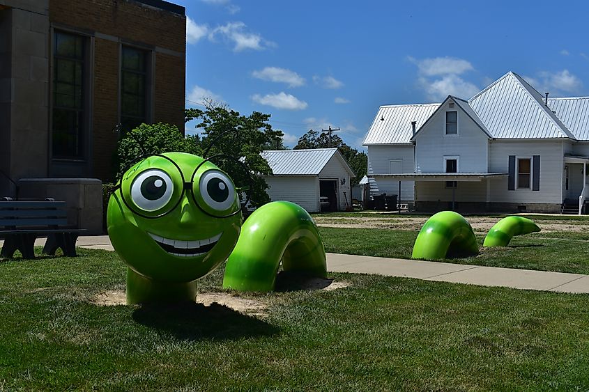 Giant green worm sculpture in front of the library in Casey, Illinois.