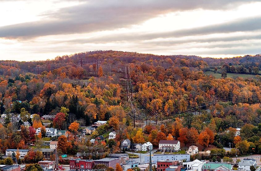 Autumn overlook of Honesdale, a small mountain town nestled in the Pocono Mountains of Pennsylvania. Vibrant foliage adorns the landscape, complementing historic architecture and offering a picturesque view of the surrounding countryside.