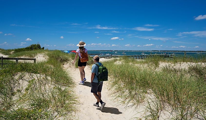 Couple hiking on the beach of Cape Lookout National Seashore near Beaufort, Carolina