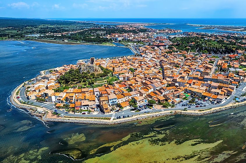 Historical circular Gruissan town built around the medieval castle with Tour Barberousse tower.