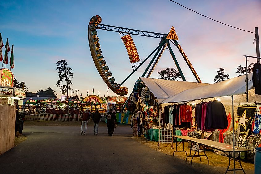 People enjoy the fair, the theme park, and vendors in Fryeburg, Maine.