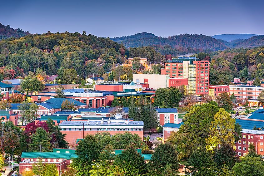 Colorful buildings of Boone, North Carolina, surrounded by fall foliage.