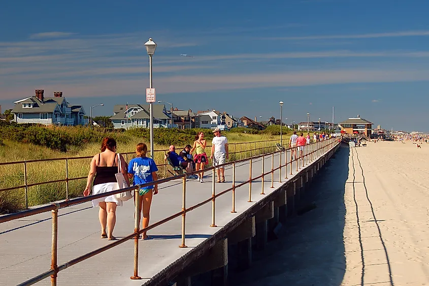 Folks enjoy a summer's day strolling on the boardwalk in Spring Lake, New Jersey.