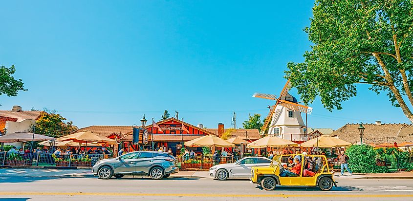 Downtown Solvang, California, with restaurants, people, and tourists along the street in the Santa Ynez Valley.