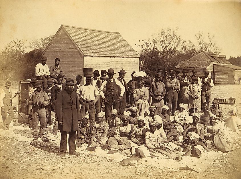 A Union soldier stands with African Americans on the plantation Thomas F. Drayton, Hilton Head Island, South Carolina, 1862.