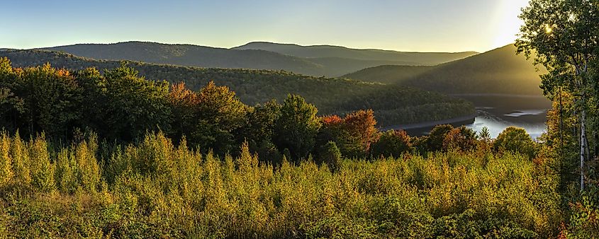 Colorful Autumn sunset on the Pepacton Reservoir seen from the Shaverton Trail in Andes in the Catskills Mountains of New York.