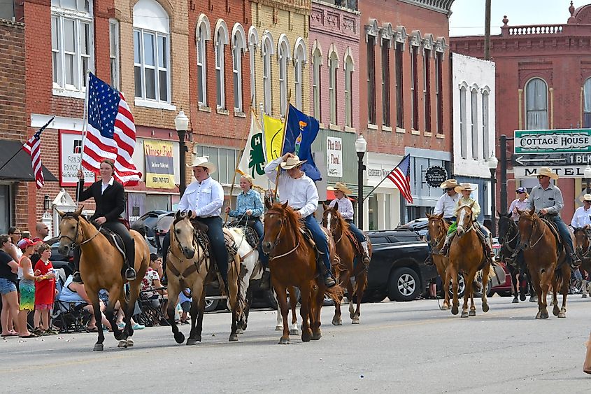 Members of the Local 4 H club ride their horses on Main Street in Council Grove, Kansas.