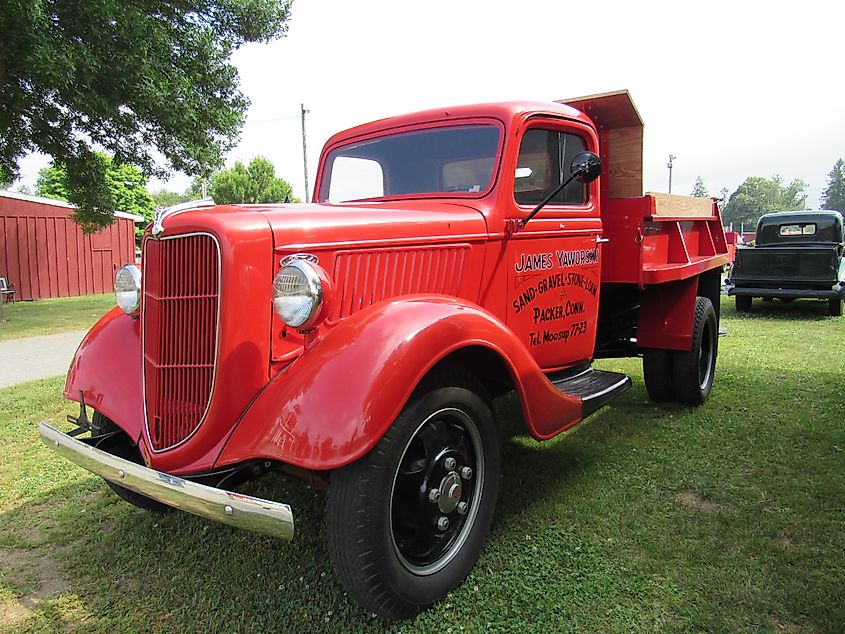 An antique red ford pick up truck at Brooklyn Fairgrounds for the ATHS Nutmeg Chapter Truck Show.