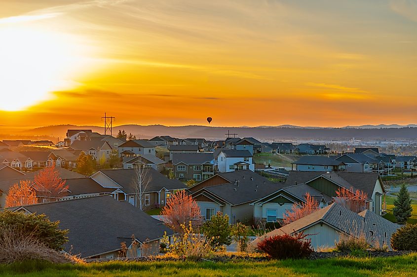 A hot air balloon flies over the city of Spokane and Spokane Valley, Washington