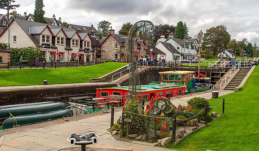 A pair of wire frame Loch Ness Monsters, in a small garden on the Caledonian Canal in Fort Augustus, just before the waterway enters Loch Ness.