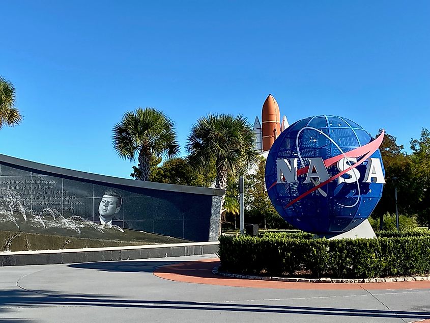 Entry Plaza with John F Kennedy Fountain, Blue NASA Logo Sphere, Space Shuttle Atlantis external tank and solid rocket boosters. Editorial credit: EWY Media / Shutterstock.com