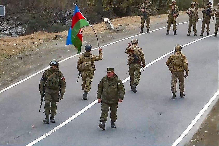 Azerbaijani soldiers and Russian peacekeepers at a checkpoint near Vank in the Kalbajar District of Azerbaijan.
