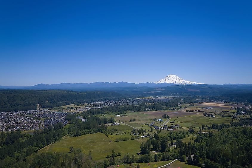 An aerial photo looking over Puyallup and Orting, WA with a view of Mt. Rainier