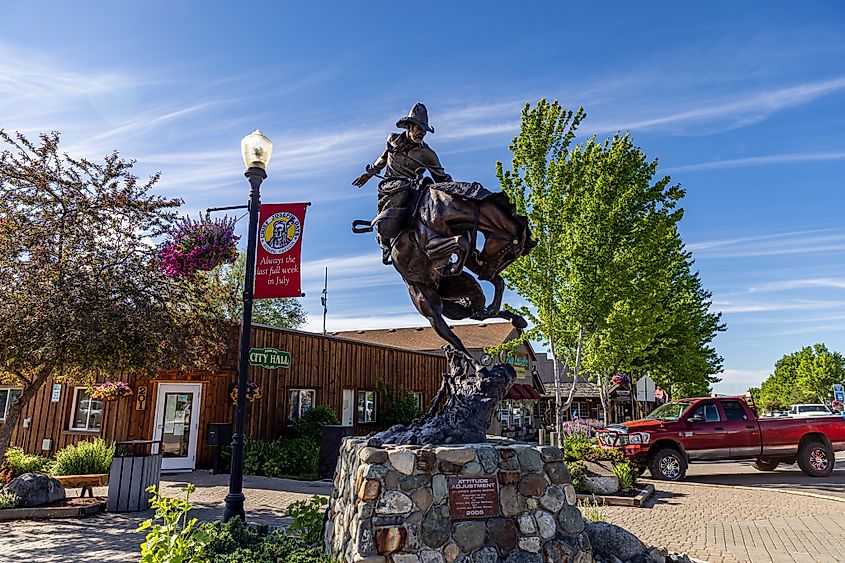 Bronze cowboy and horse statue monument in downtown Joseph, Oregon.