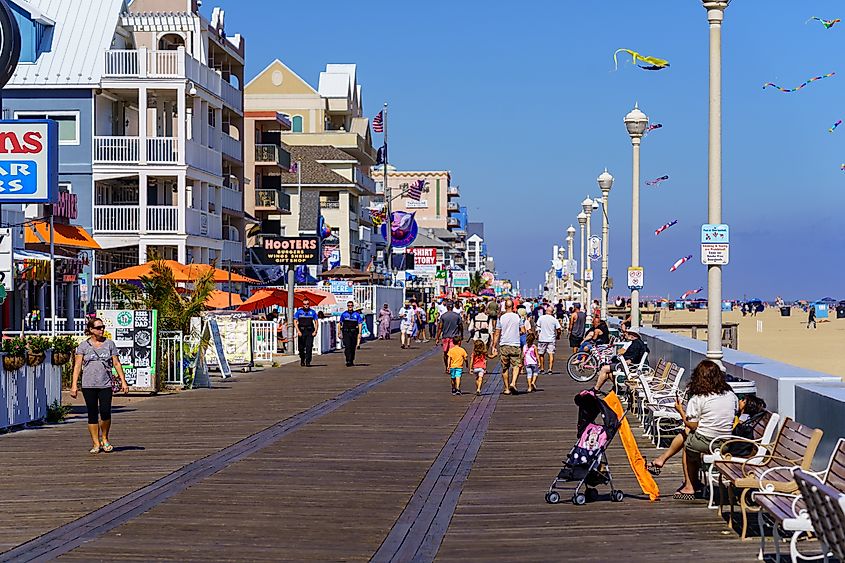 People walking along the Ocean City Boardwalk in Maryland.