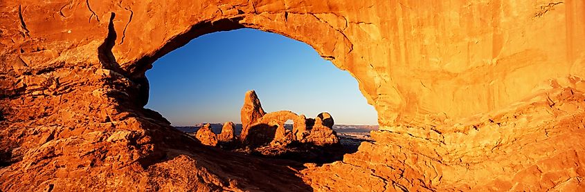 Turret arch through north window at sunrise, arches national park, moab, utah, united states of america.