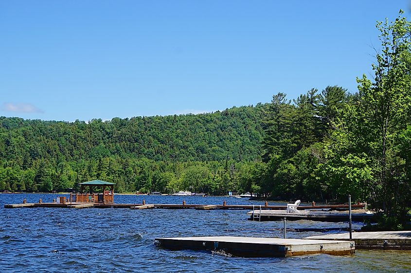 Wooden boat docks on Fourth Lake, Inlet, New York, part of the Fulton Chain Lakes in Adirondack Park.