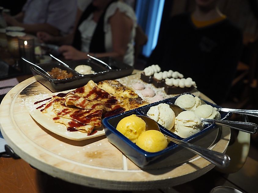 An assortment of Finnish desserts, including pancakes, pastries, ice cream, and jam, served at Restaurant Harald in Espoo, Finland. Image Credit JIP via Wikimedia