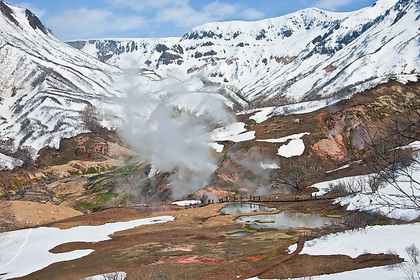 Tourists during a tour at the thermal field in the Valley of Geysers in Kronotsky reserve, Kamchatka, Russia.