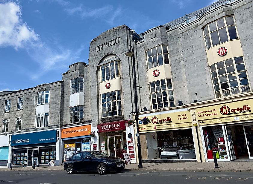 The Whitehall, an historic landmark building with retail shops on ground floor level in the High Street, East Grinstead, UK