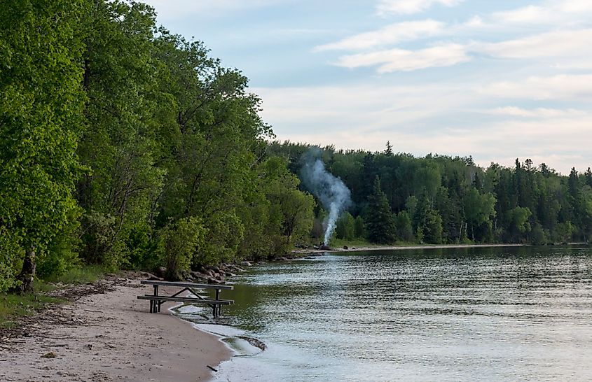 A beckoning campfire on the beach at Cold Lake Provincial Park, Alberta.