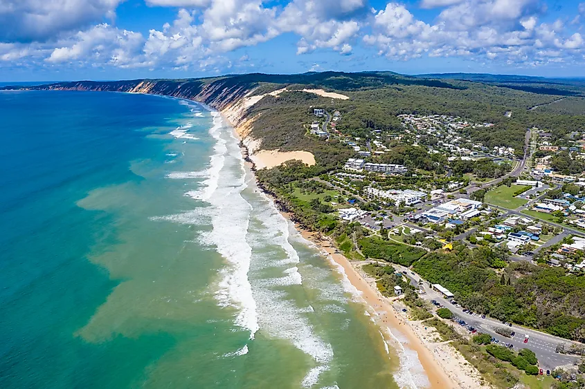 The ocean washing the shores of Rainbow Beach in Queensland, Australia.