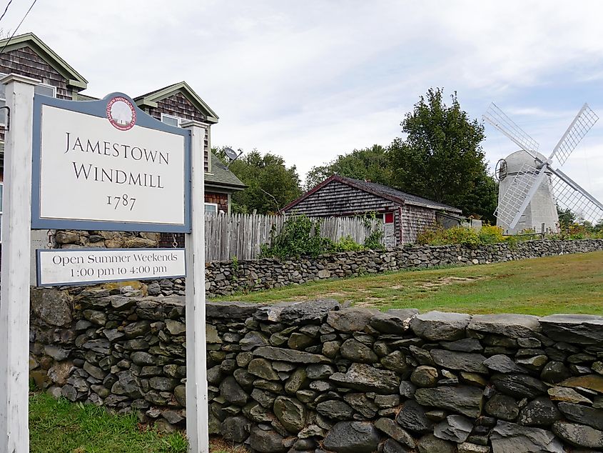 JAMESTOWN, RHODE ISLAND—SEPTEMBER 2017: Sign board of the Jamestown Windmill built in 1787, with the 30-foot high windmill North Road Jamestown. Photo RaksyBH via Shutterstock