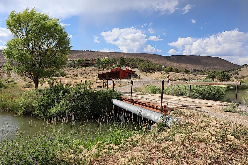 A beautiful view of a bridge over aqueduct water in Paonia, Colorado