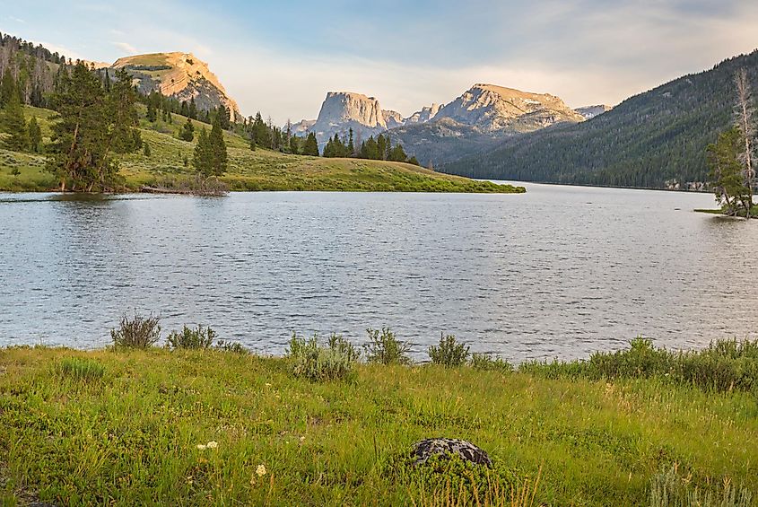 Sunset over the Wind River Wilderness Area in the Green River area of Wyoming, showcasing majestic mountains, lakes, and wildflowers along hiking trails.