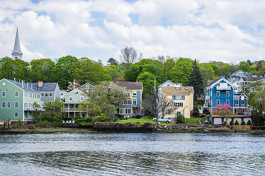 Mill River in New Haven, Connecticut, with calm water reflecting surrounding trees.