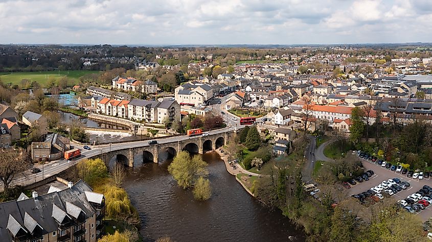 An aerial landscape of Wetherby in West Yorkshire with road bridge and weir over the river Wharfe.