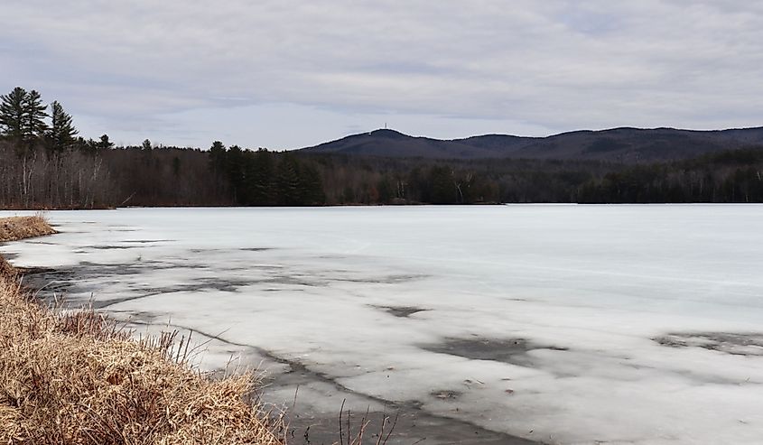 A view of Mt Sunapee in New Hampshire, from a frozen lake during winter.