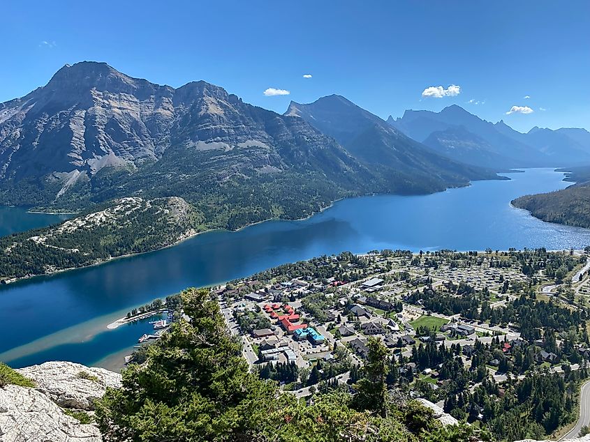 A lakeside mountain town as seen from a viewpoint above. 