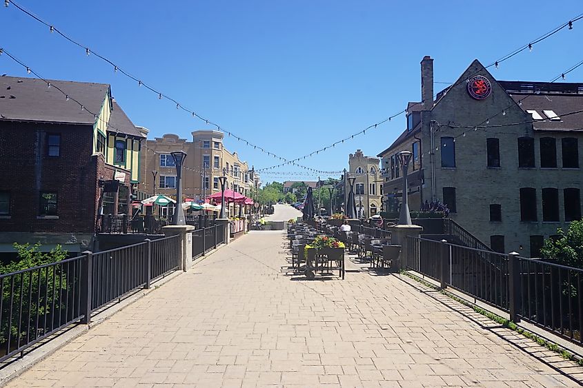 1 ⁄ 1 More details A pedestrian bridge and the Buckatabon and Café Hollander patio in Wauwatosa, Wisconsin.