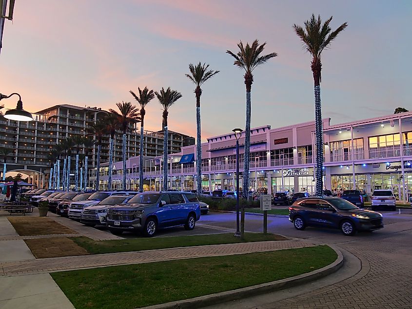 The Wharf shopping area in Orange Beach, Alabama, featuring various shops, restaurants, and entertainment options.