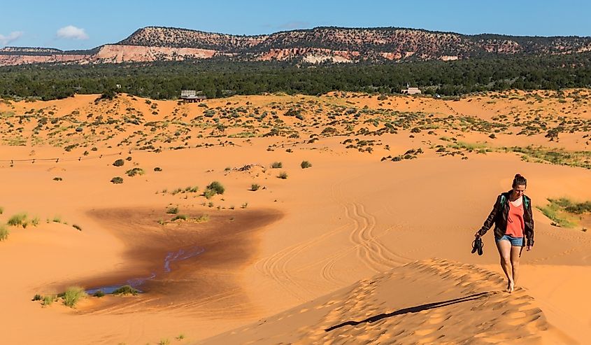 Girl in Coral Pink Sand Dunes State Park, Utah.