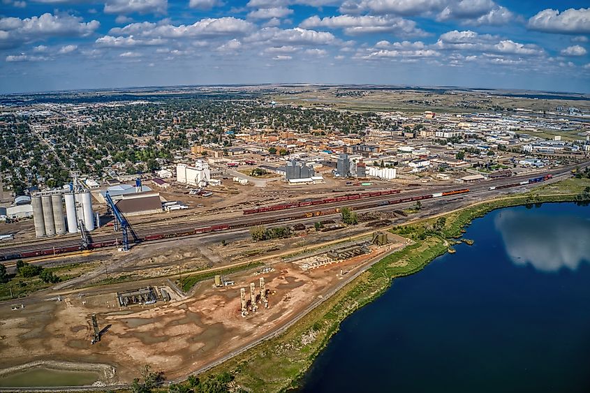 Aerial view of Williston, North Dakota, in the Bakken Oil Fields, showcasing the town’s infrastructure surrounded by oil rigs and industrial activity.