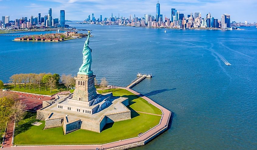 Aerial View of Statue of Liberty, Ellis Island and Lower Manhattan Skyline from New York Harbor near Liberty State Park in New Jersey